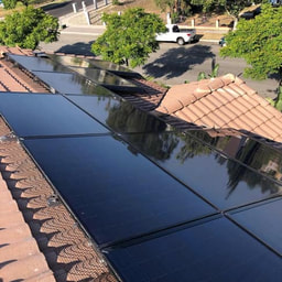 After photo of freshly cleaned solar panels on roof of house in Inland Empire, California